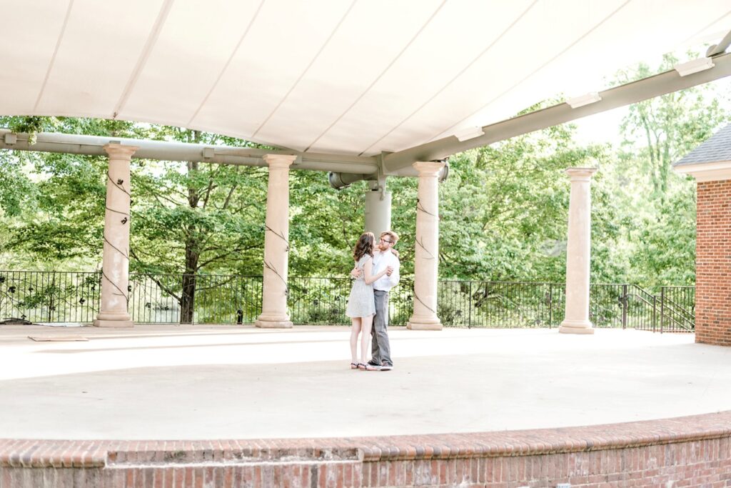 Fiancés dance on gazebo during Furman University engagement session 