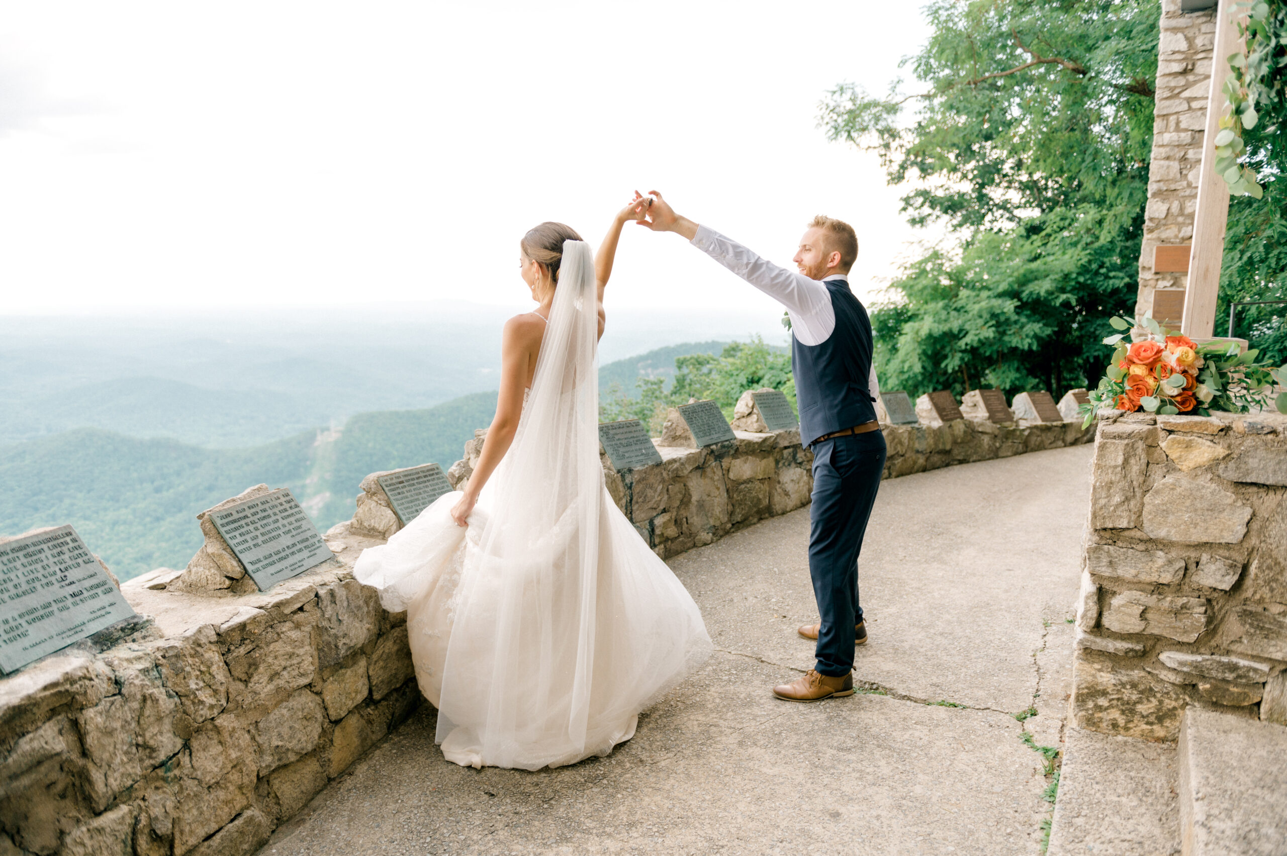 Adventure elopement photography on Bald Rock with couple dancing in front of Pretty Place cross