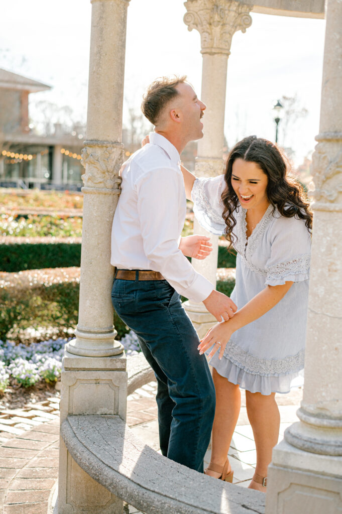 Couple laughing in an angled Furman Rose Garden gazebo