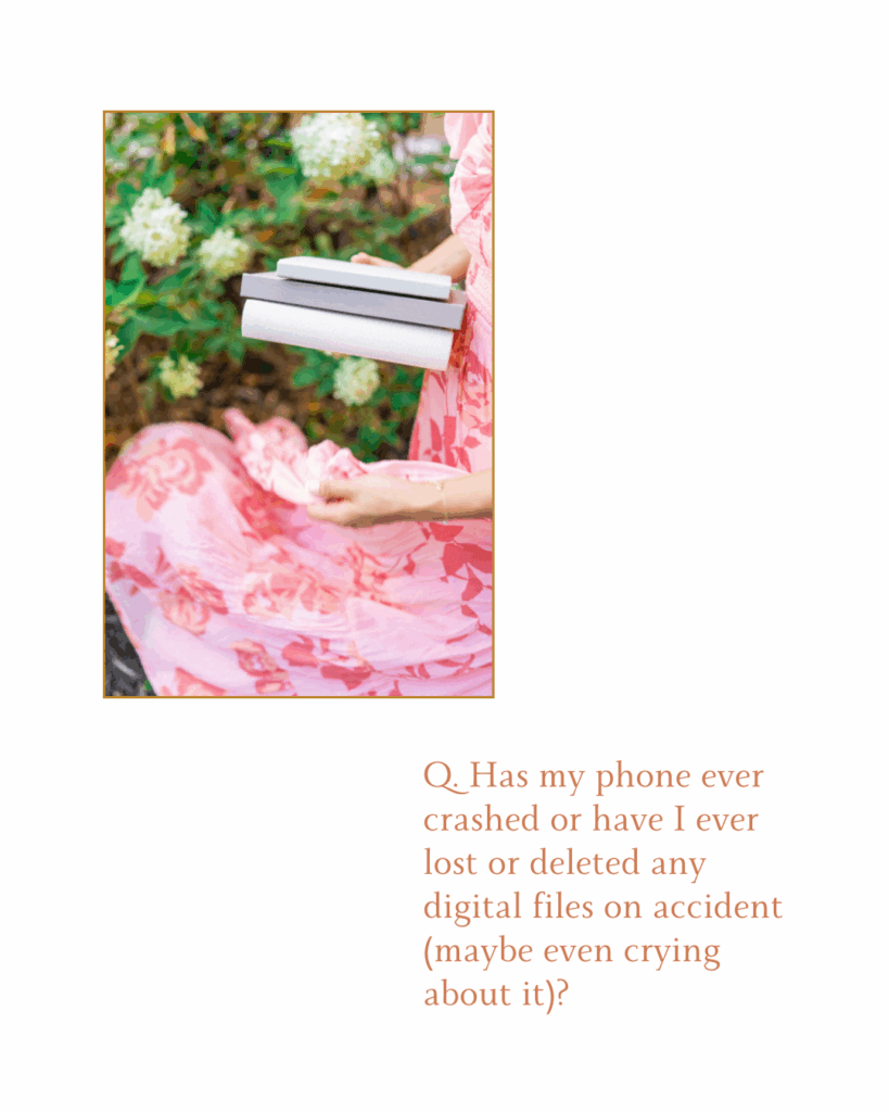Photo of female photographer's hands and bottom of flowy pink skirt twirling as the photographer holds photo albums in front of a hydrangea bush. 