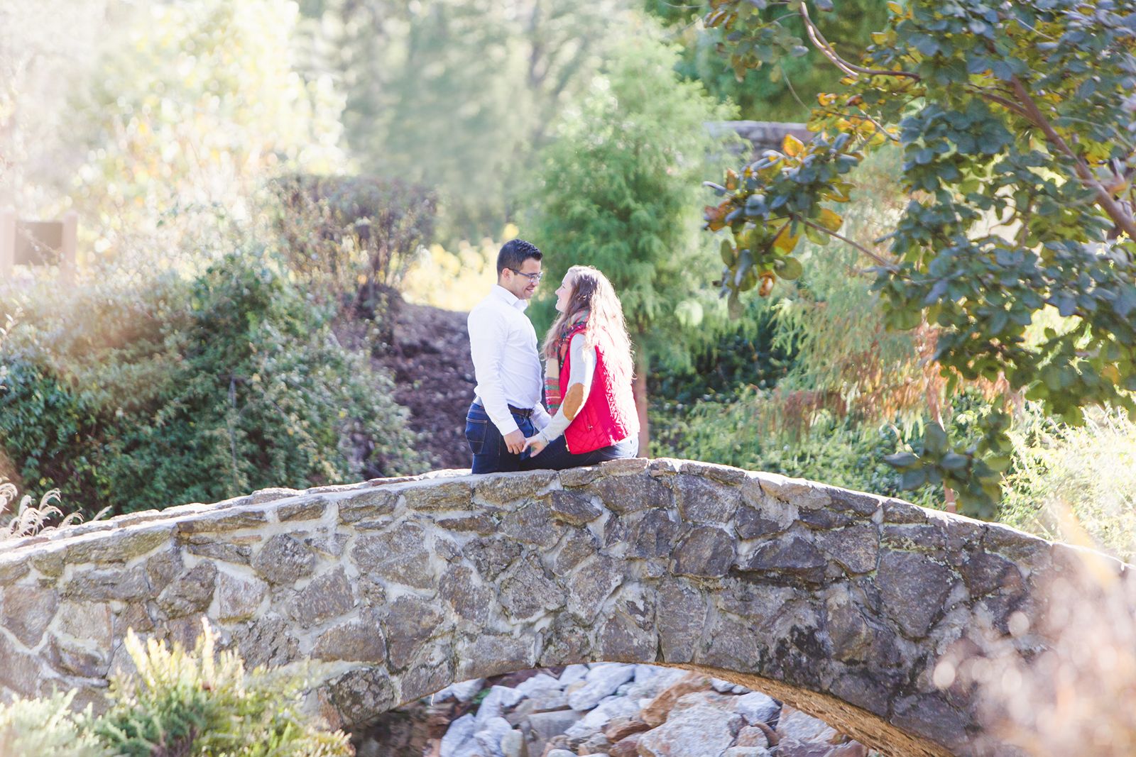 Couple looking at each other after garden proposal