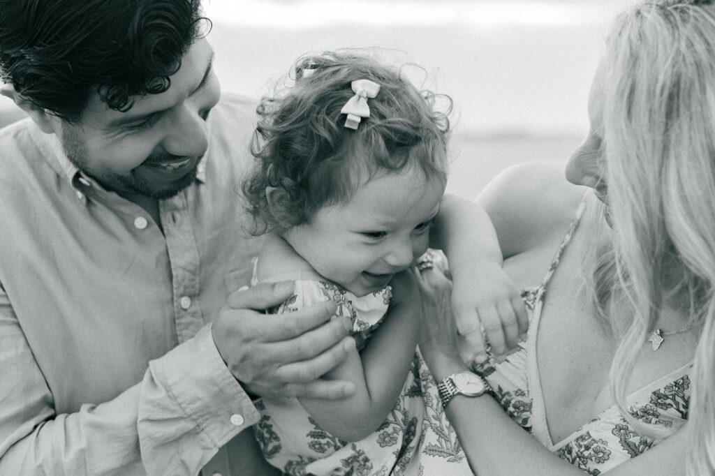 Baby tickled at the beach