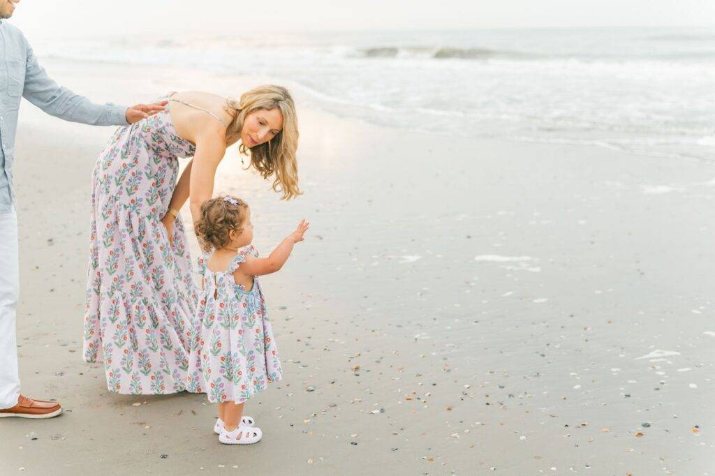 Toddler waves at the sea at Hilton Head