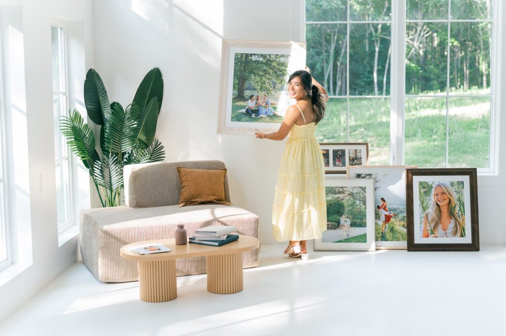Charleston engagement photographer with frames in studio