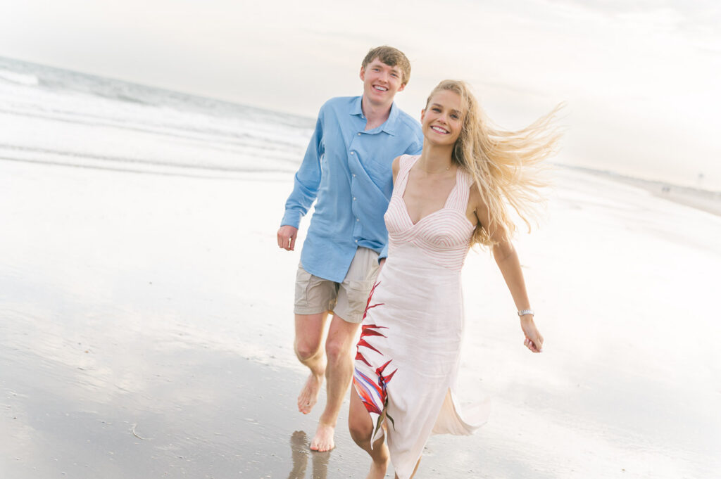 Couple running on Folly Beach 
